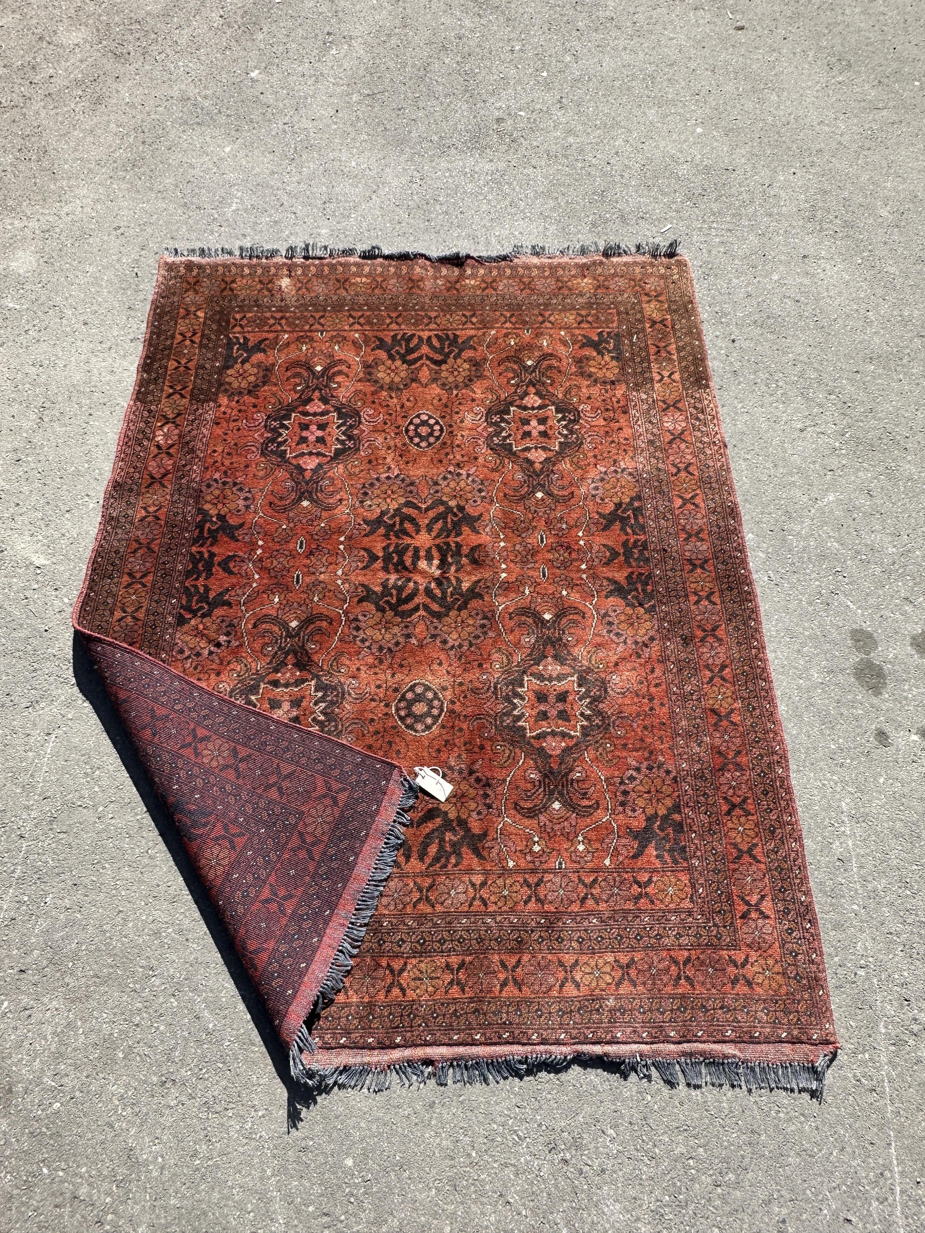 A Belouch red ground rug, 190 x 150cm.